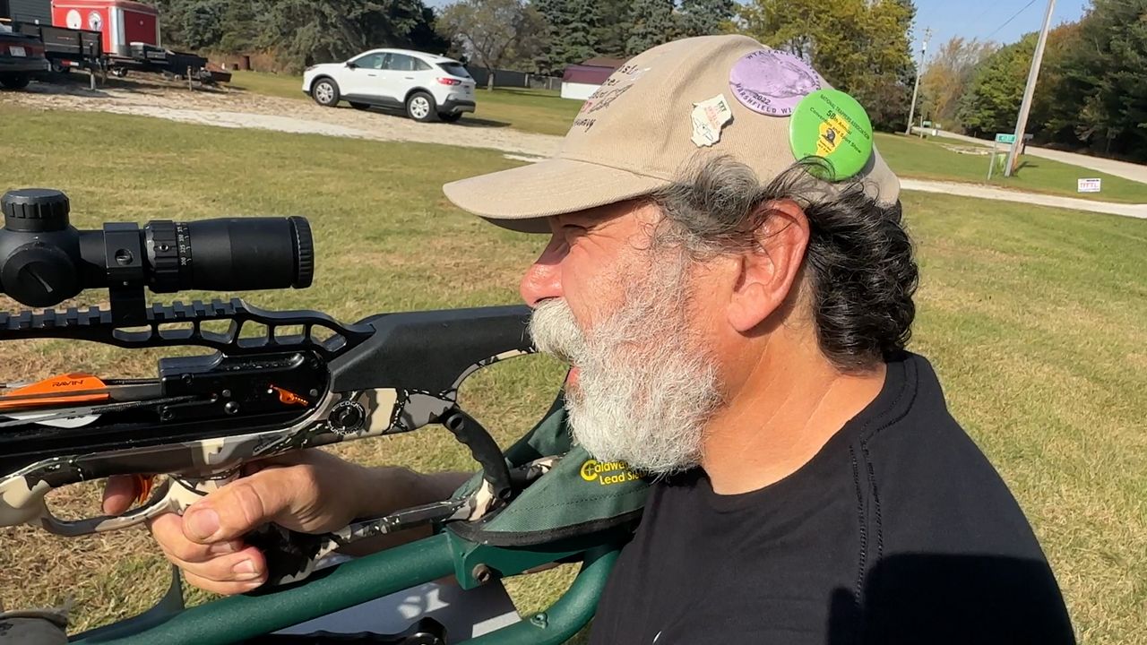 Dan Cichantek aiming to shoot his crossbow