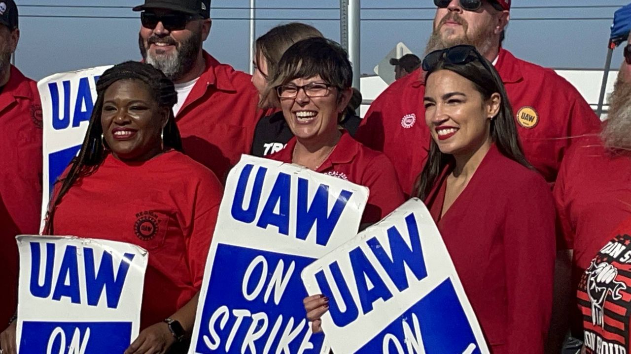 U.S. Rep. Cori Bush, D-St. Louis, (left) and U.S. Rep. Rep. Alexandria Ocasio-Cortez, D-Bronx (right) joined striking autoworkers outside a General Motors plant in Wentzville, Mo. Sunday following a rally with UAW workers and their supporters. On Wednesday, Bush announced she had tested positive for COVID-19 and was in isolation. (Spectrum News/Gregg Palermo)