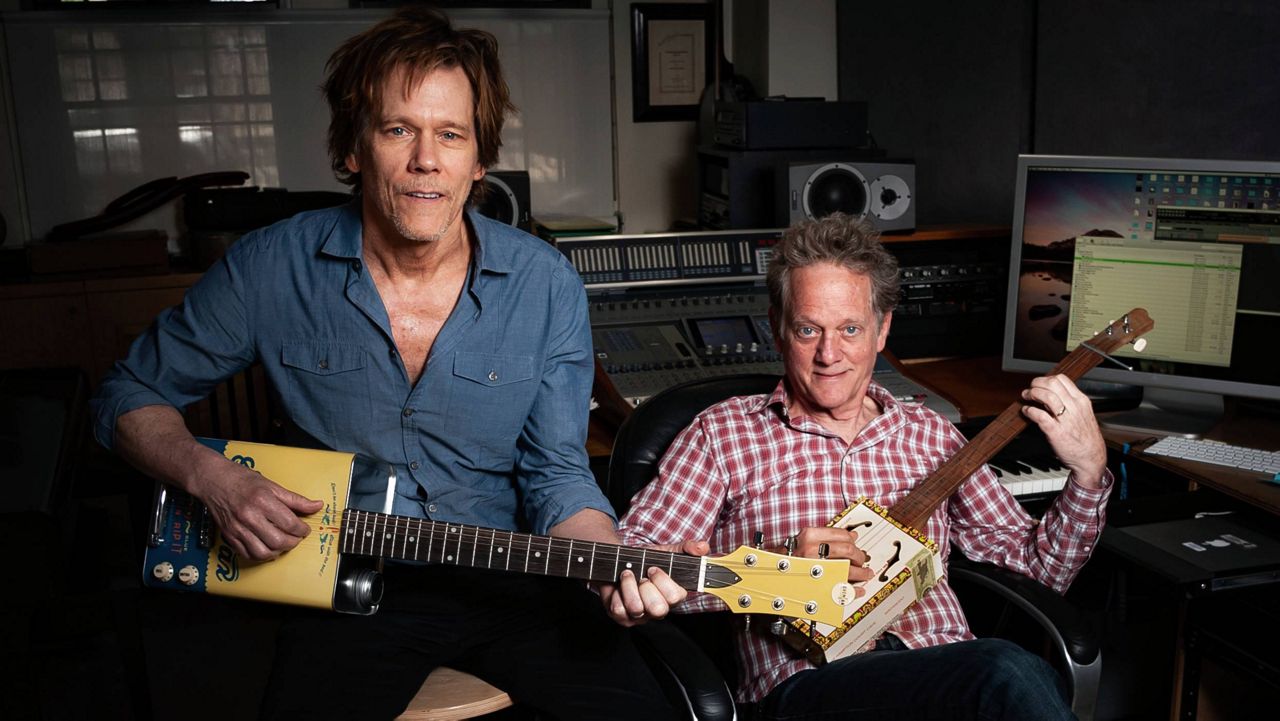 In this May 28, 2018 photo, brothers Kevin Bacon, left, and Michael Bacon pose in New York to promote their self-titled album out Friday. (Photo by Christopher Smith/Invision/AP)