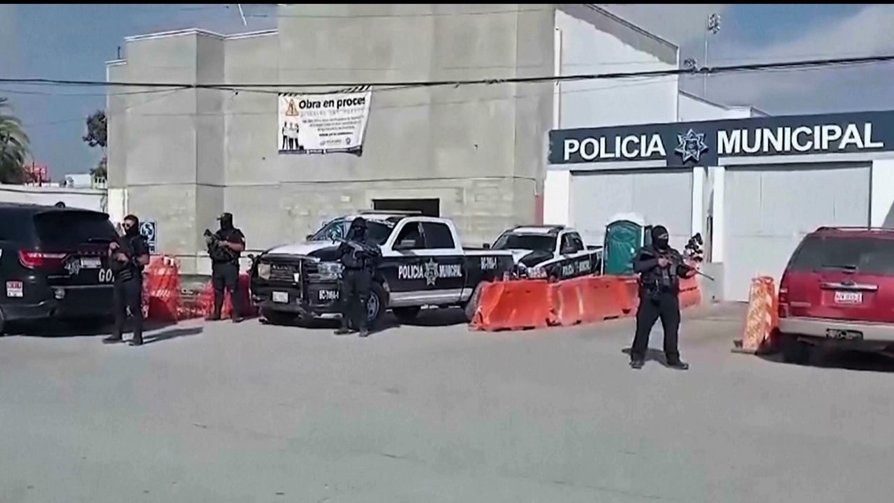 In this image made from video, Mexico's police officers stand guard at the Ensenada station in Ensenada, Mexico, Thursday, May 2, 2024. (AP Photo)