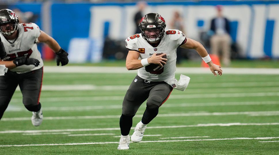 Tampa Bay Buccaneers quarterback Baker Mayfield scrambles for a 11-yard touchdown during the second half of an NFL football game against the Detroit Lions, Sunday, Sept. 15, 2024, in Detroit. (AP Photo/Paul Sancya)