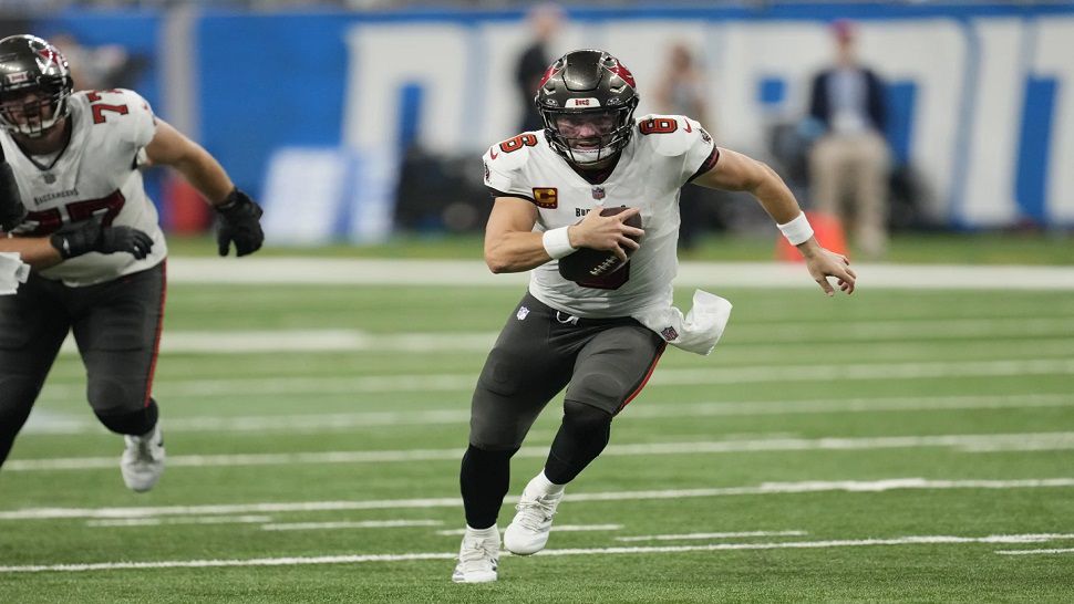 Tampa Bay quarterback Baker Mayfield scrambled for an 11-yard touchdown against Detroit on Sunday.