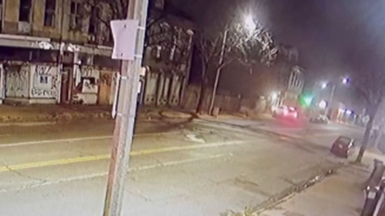 Street surveillance footage released by Morris’ attorney shows an SLMPD vehicle driving down Broadway and then breaking before crashing into the bar around 12:30 a.m. Monday. (Photo credit: surveillance footage)