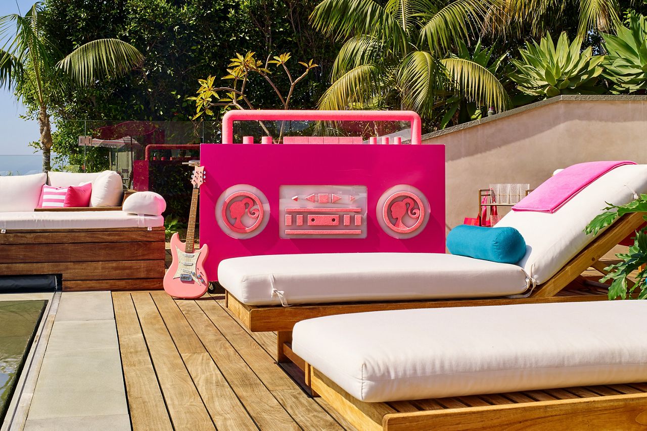 Features an infinity pool overlooking California's coast with a giant Barbie boom box.