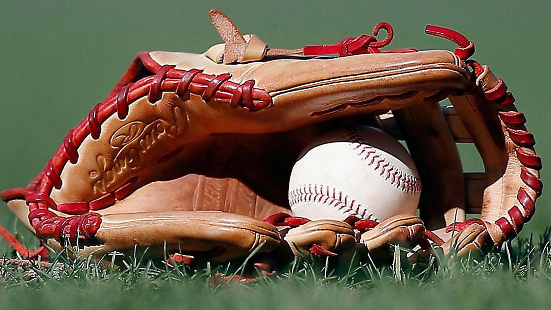 A baseball glove and ball appear in this file image. (Michael Dwyer/Associated Press)