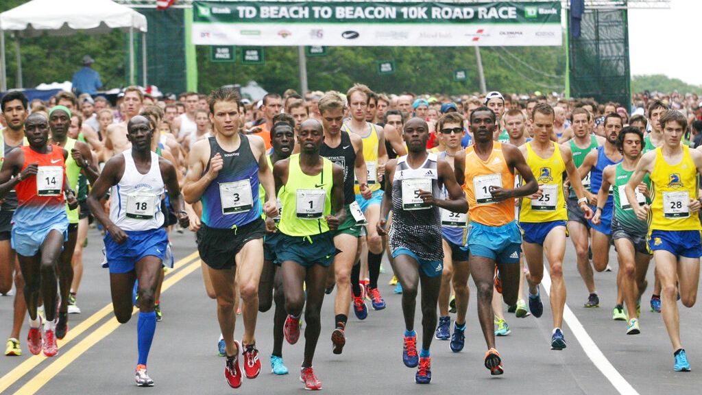 FILE - In this Aug. 2, 2014, file photo, runners leave the start of the 17th annual TD Bank Beach To Beacon 10K road race in Cape Elizabeth, Maine. The realization that more must be done to detect drug use is hitting many in the world of small, friendly U.S. road races _ 5 and 10Ks, half and full marathons that often benefit charities and are filled with thousands of weekend joggers, fitness enthusiasts and even a good number of elites who aren't at the Olympic level. (AP Photo/Joel Page, File)