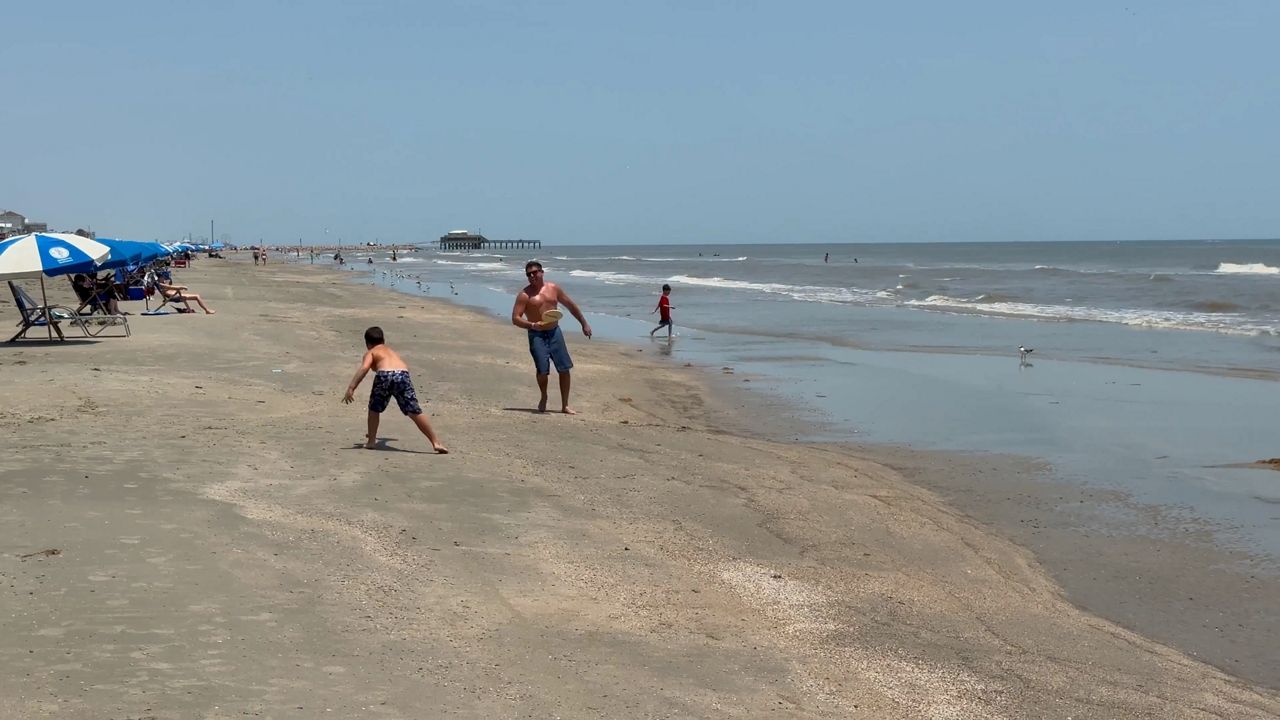 Galveston beachgoers braved the heat, potential tropical storm threat