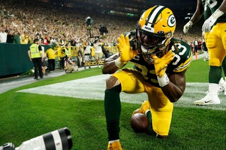 Chicago Bears defensive tackle Justin Jones (93) runs on the field before  an NFL game between the Chicago Bears and the Green Bay Packers Sunday, Sept.  18, 2022, in Green Bay, Wis. (