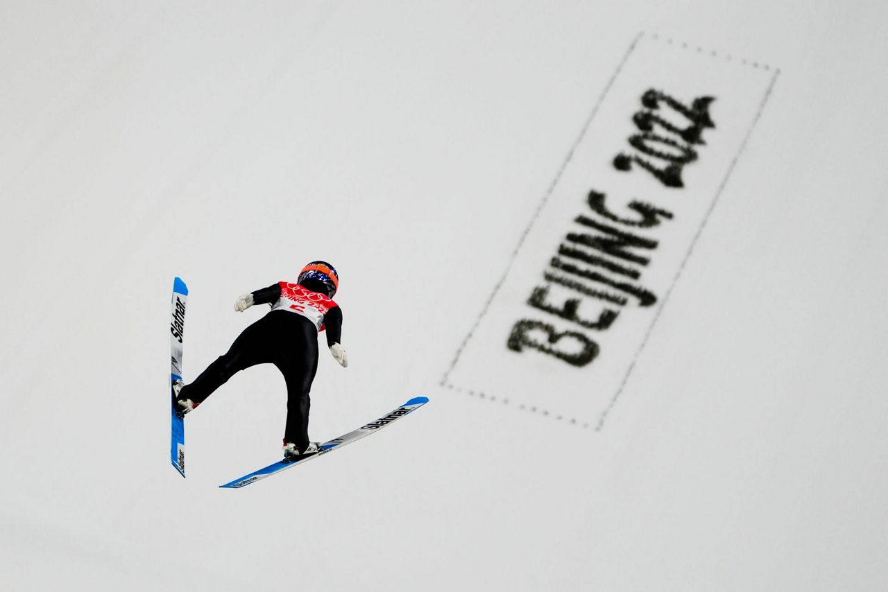 Slovenia wins Olympic debut of ski jumping mixed team