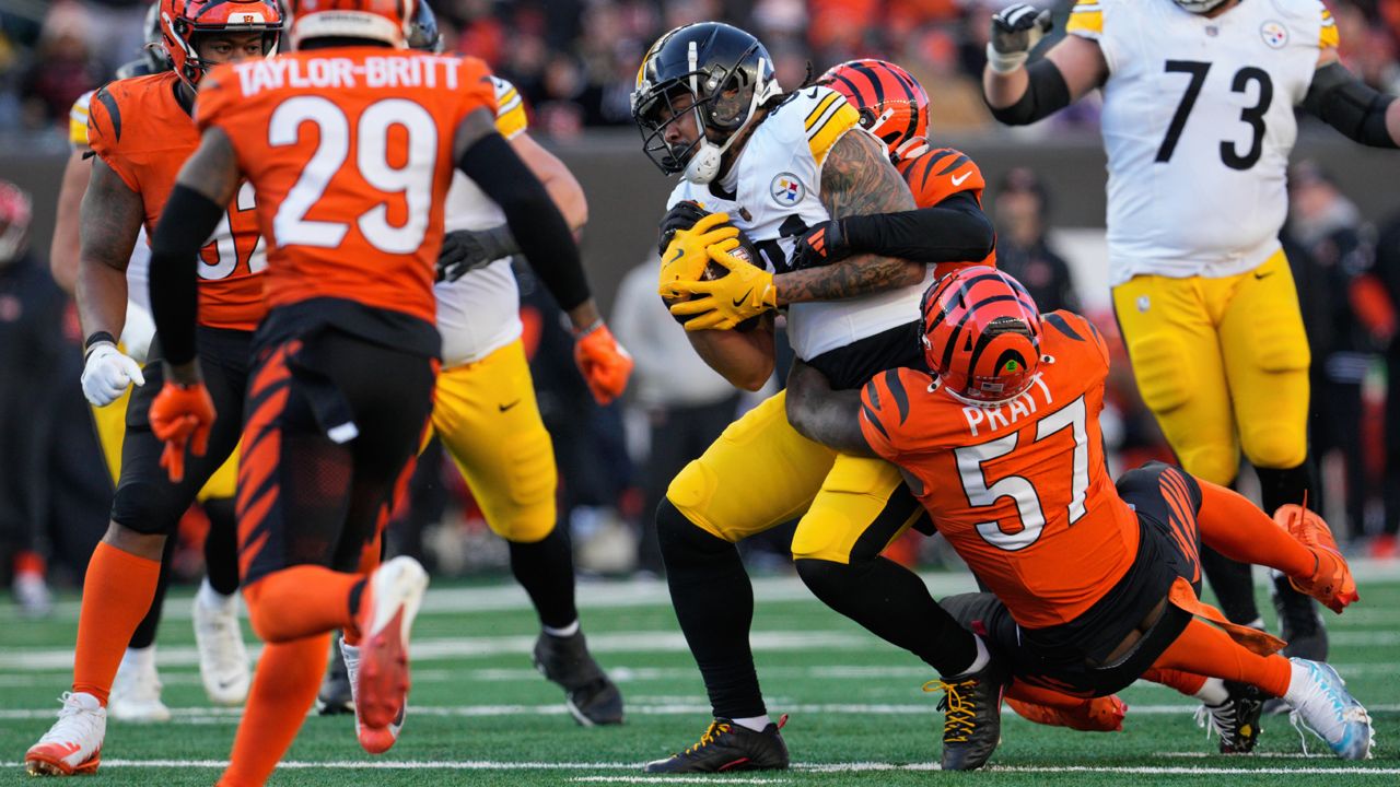 Pittsburgh Steelers tight end MyCole Pruitt is tackled by Cincinnati Bengals linebacker Germaine Pratt (57) during the second half of an NFL football game, Sunday, Dec. 1, 2024, in Cincinnati.