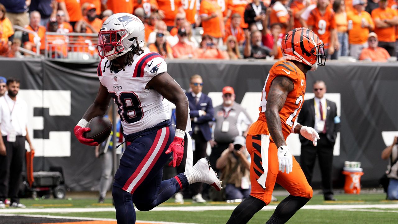 New England Patriots running back Rhamondre Stevenson (38) scores on a 3-yard touchdown run during the first half of an NFL football game against the Cincinnati Bengals, Sunday, Sept. 8, 2024, in Cincinnati. (AP Photo/Jeff Dean)