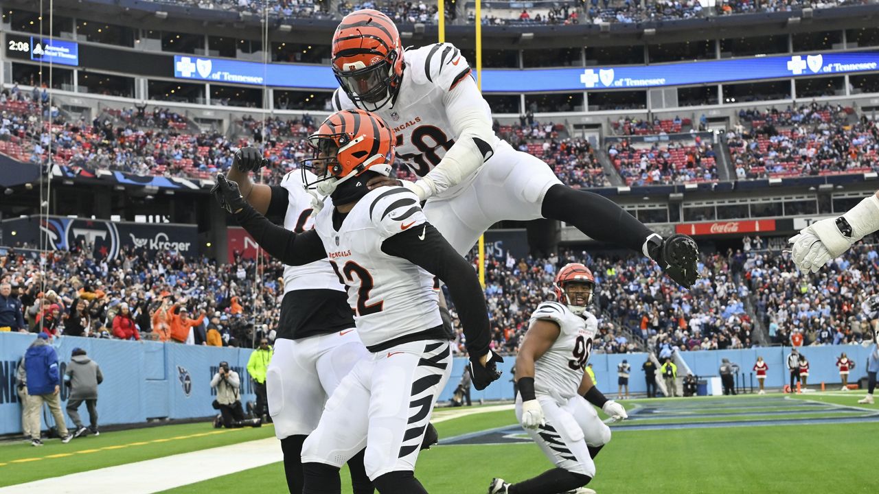 Cincinnati Bengals safety Geno Stone (22) celebrates after scoring a touchdown during the second half of an NFL football game against the Tennessee Titans, Sunday, Dec. 15, 2024, in Nashville, Tenn. (AP Photo/John Amis)