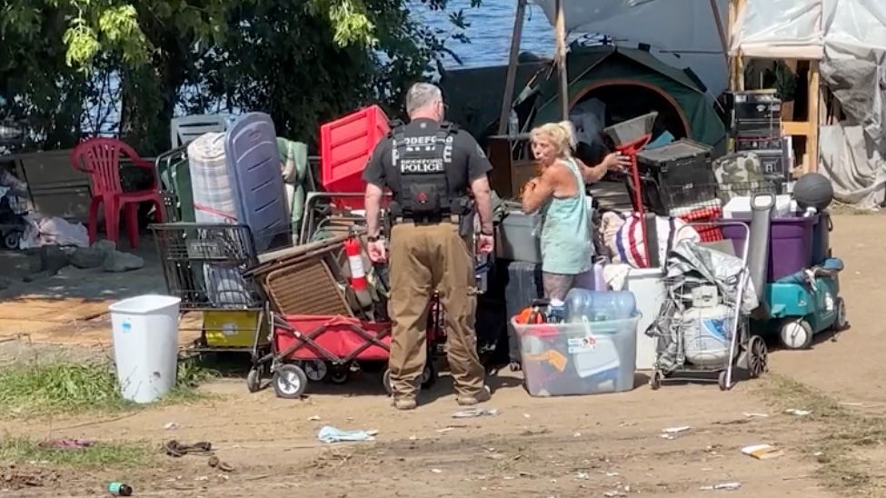 Police help to close down a homeless camp in Biddeford in July 2024. Seeds of Hope, the city's largest shelter, is working on a renovation project that city officials are working to arrange funding for after a grant that was supposed to pay for it fell through. (Spectrum News File Photo)