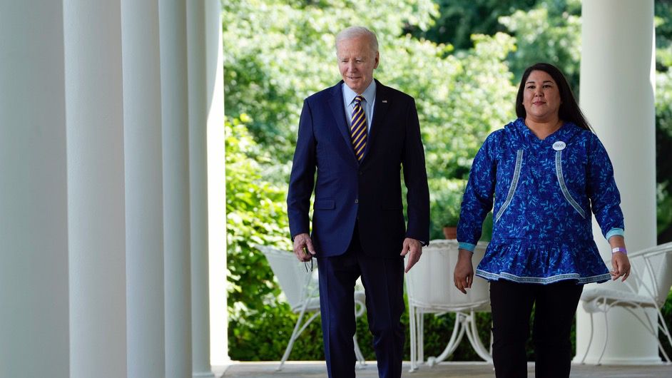 President Joe Biden walks with Alannah Hurley, executive director of the United Tribes of Bristol Bay, to the Rose Garden of the White House in Washington, Thursday, May 11, 2023, for an event on the conservation efforts taken by his administration. (AP Photo/Susan Walsh)