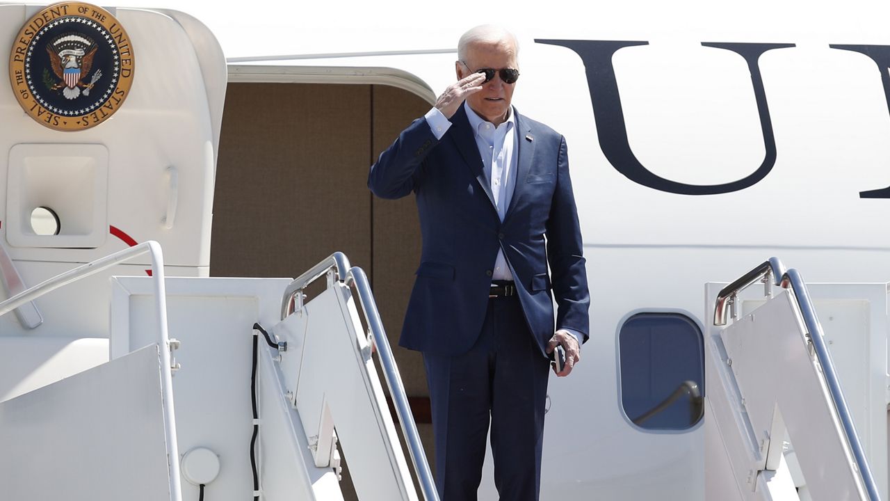 President Joe Biden returns a salute as he boards Air Force One, Tuesday, April 16, 2024, at Andrews Air Force Base, Md. Biden is headed to Pennsylvania. (AP Photo/Luis M. Alvarez)