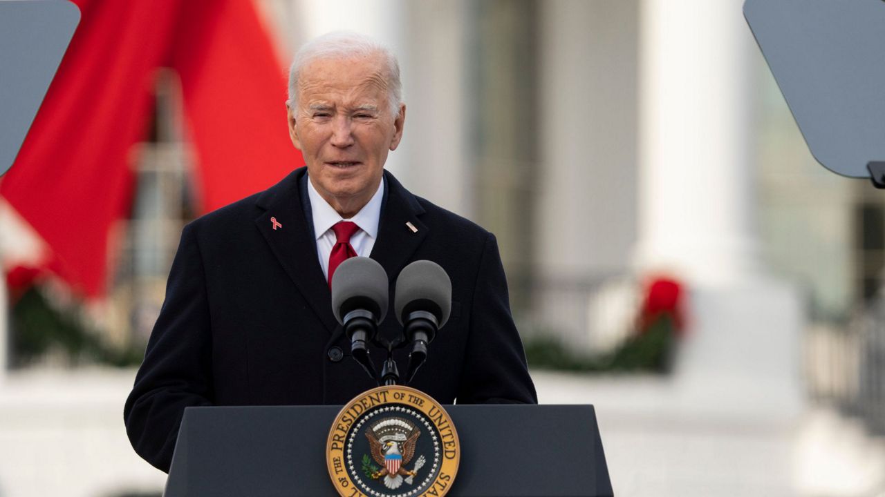 President Joe Biden speaks on the South Lawn of the White House during a ceremony to commemorate World AIDS Day with survivors, their families and advocates, Sunday, Dec. 1, 2024, in Washington. (AP Photo/Manuel Balce Ceneta)