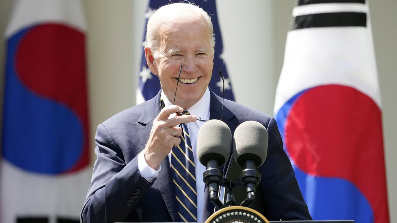 President Joe Biden takes his sunglasses off at a news conference with South Korea's President Yoon Suk Yeol in the Rose Garden of the White House Wednesday, April 26, 2023, in Washington. (AP Photo/Andrew Harnik)