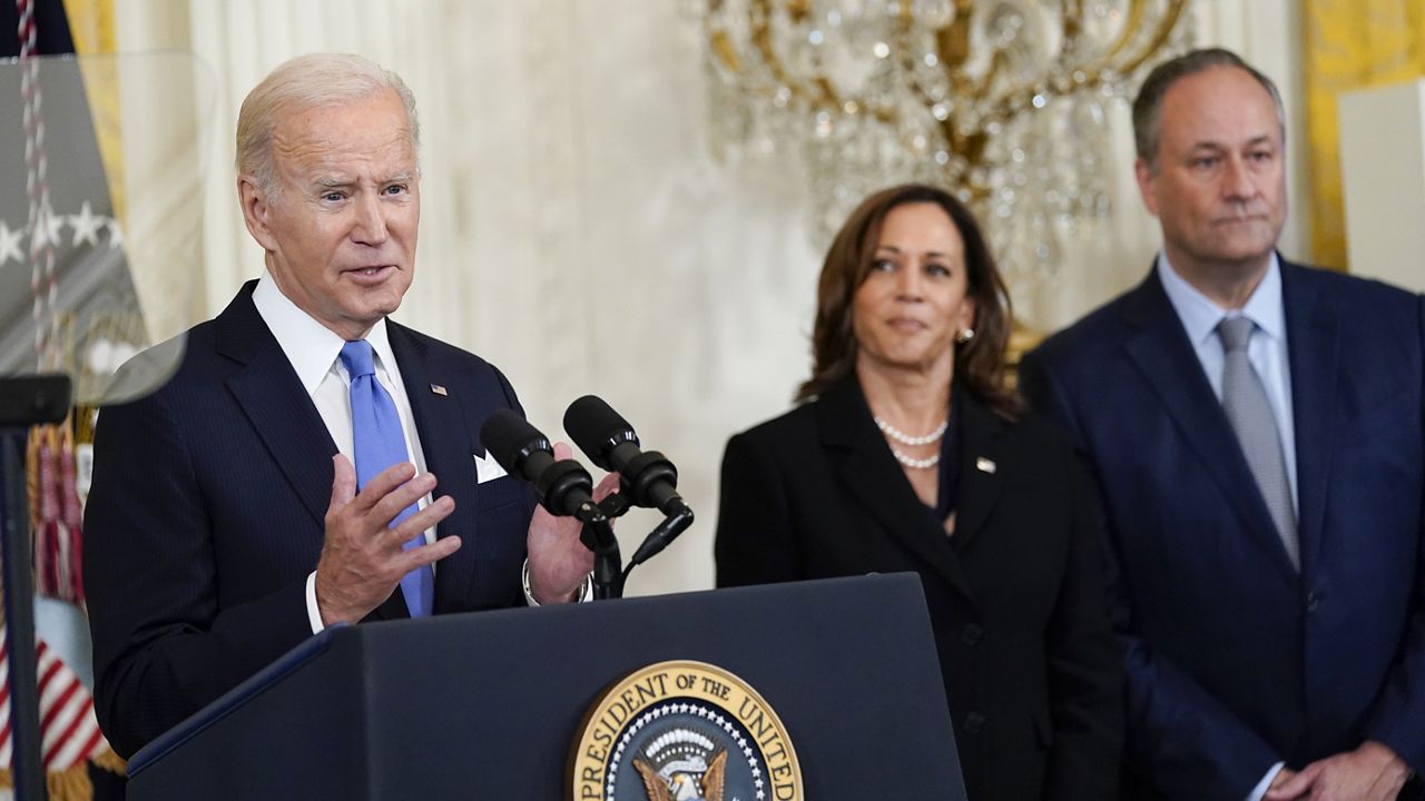 President Joe Biden speaks during a reception to celebrate the Jewish new year in the East Room of the White House in Washington, Friday, Sept. 30, 2022. Vice President Kamala Harris and her husband Doug Emhoff stand at right. (AP Photo/Susan Walsh)