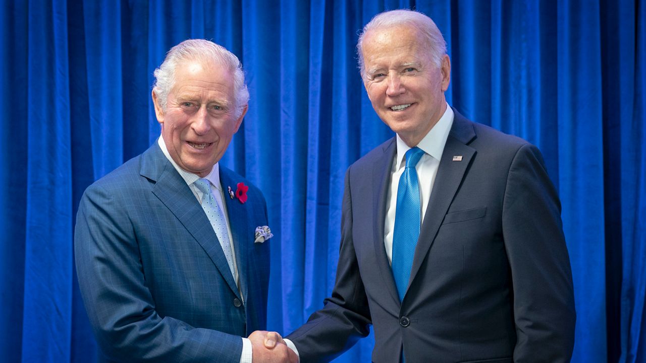 Britain's then-Prince Charles, left, greets President of the United States Joe Biden ahead of their bilateral meeting during the Cop26 summit at the Scottish Event Campus (SEC) in Glasgow, Scotland, Nov. 2, 2021. A dash of pomp and a dose of politics are on the agenda during a flying visit to the U.K. where President Joe Biden will discuss the environment with King Charles III and the war in Ukraine with Prime Minister Rishi Sunak. Biden flies to London Sunday, July 9, 2023 on his way to a NATO summit in Lithuania. (Jane Barlow/Pool Photo via AP, File)