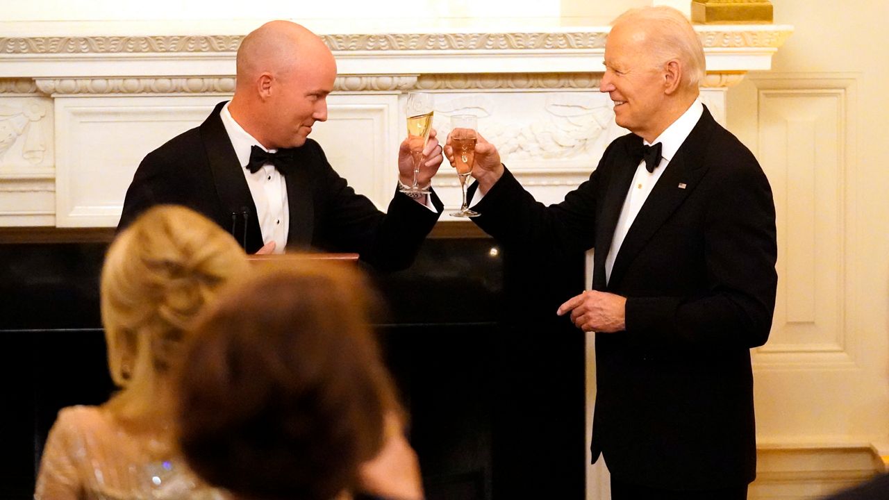 Utah Gov. Spencer Cox, left, and President Joe Biden toast before Biden speaks to members of the National Governors Association during an event in the State Dining Room of the White House in Washington, Saturday, Feb. 24, 2024. (AP Photo/Stephanie Scarbrough)