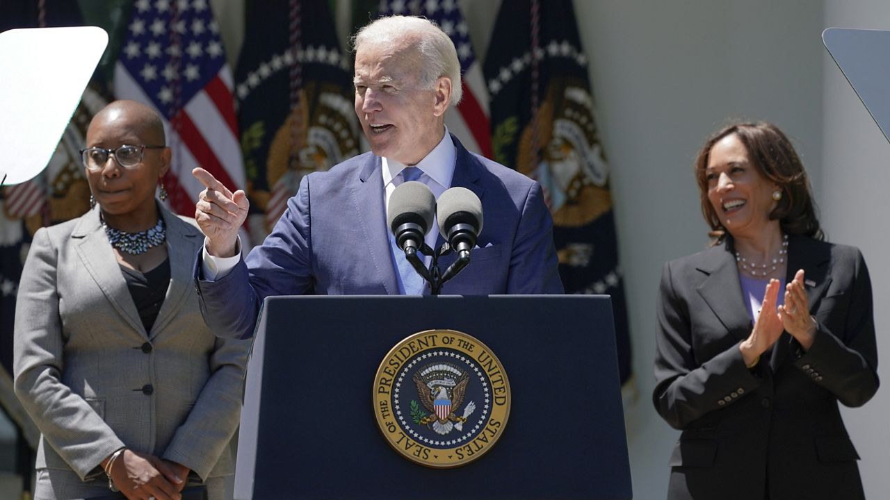 FILE - President Joe Biden speaks at an event on lowering the cost of high-speed internet in the Rose Garden of the White House, Monday, May 9, 2022, in Washington. Vice President Kamala Harris, right, and Alicia Jones, a beneficiary of the Affordable Connectivity program, listen. (AP Photo/Manuel Balce Ceneta)