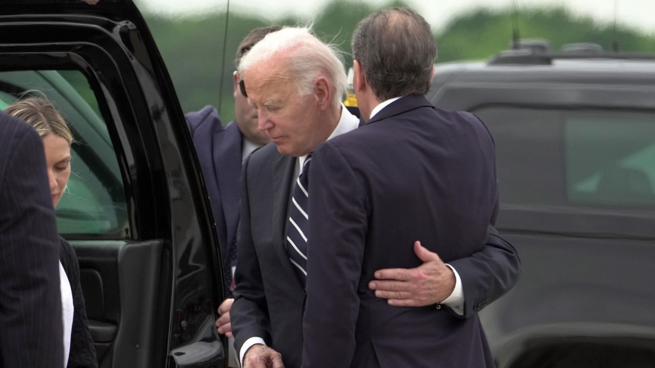 President Joe Biden greets his son Hunter Biden at Delaware Air National Guard Base in New Castle, Del., Tuesday, June 11, 2024. (AP Photo/Manuel Balce Ceneta)