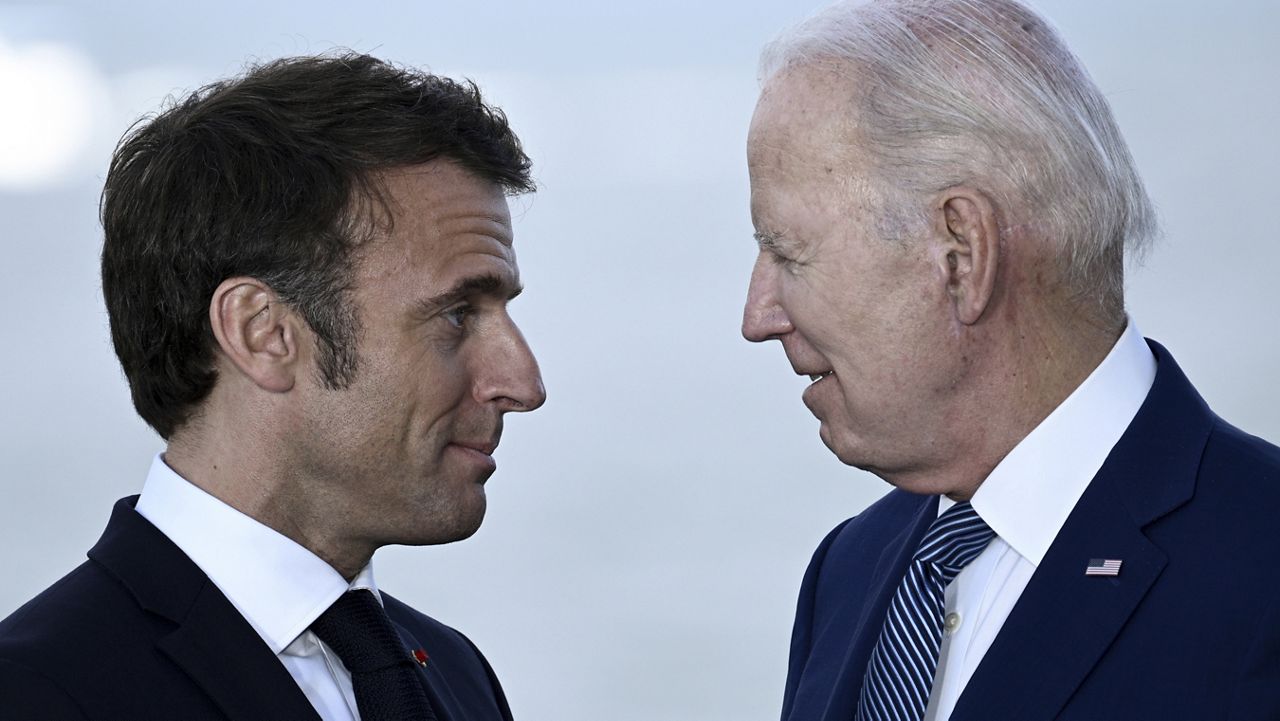 FILE - France's President Emmanuel Macron, left, speaks with U.S. President Joe Biden after a family photo of leaders of the G7 and invited countries during the G7 Leaders' Summit in Hiroshima, western Japan, Saturday, May 20, 2023. (Brendan Smialowski/Pool Photo via AP)