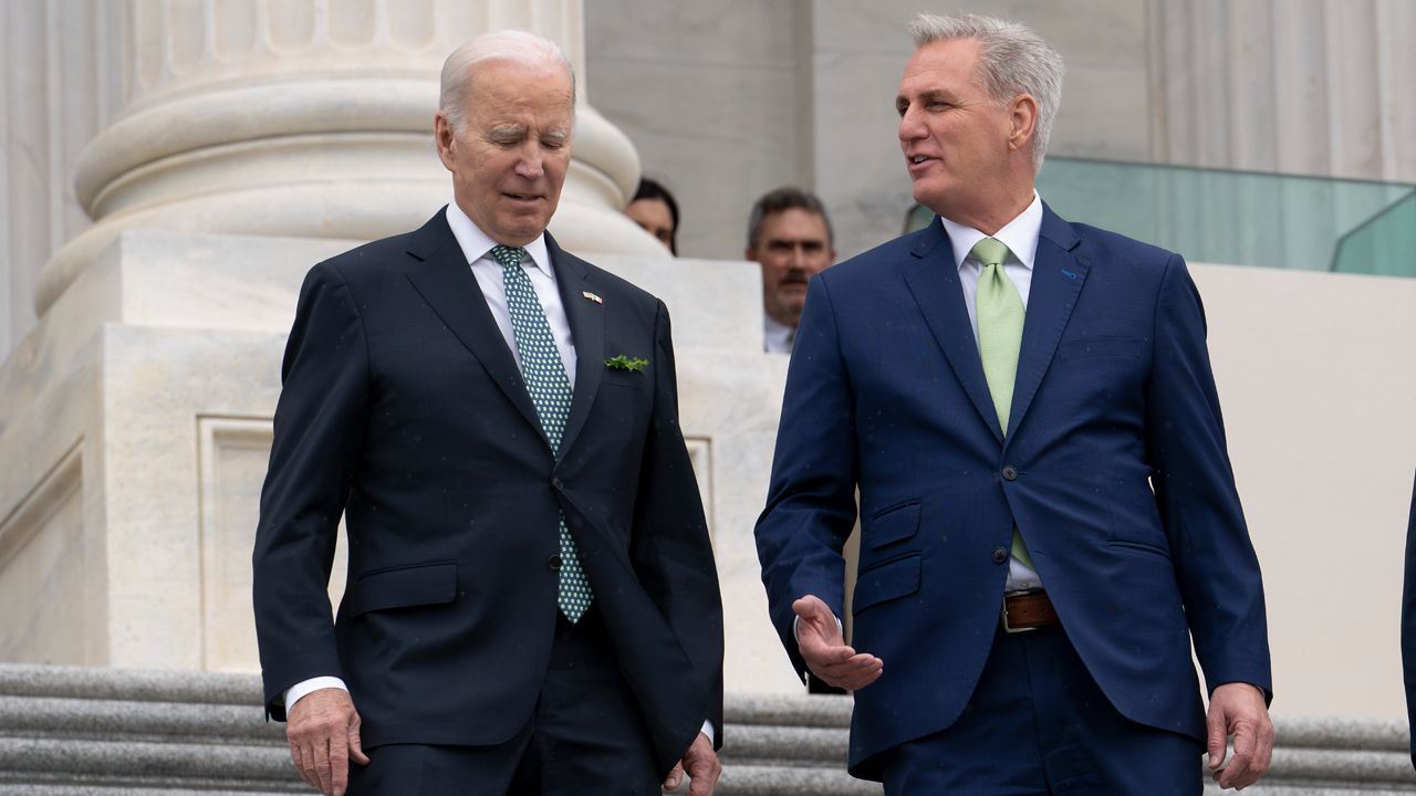 President Joe Biden walks with House Speaker Kevin McCarthy, R-Calif., as he departs the Capitol following the annual St. Patrick's Day gathering, in Washington, Friday, March 17, 2023. Facing the risk of a government default as soon as June 1, President Joe Biden has invited the top four congressional leaders to a White House meeting for talks. (AP Photo/J. Scott Applewhite, File)