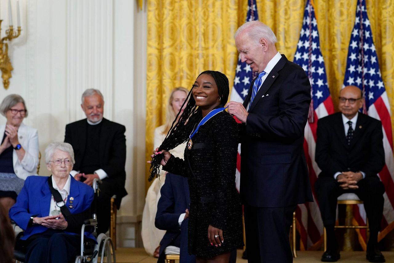 Biden awards Medal of Freedom to Biles, McCain, Giffords