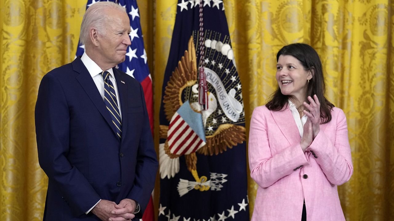 President Joe Biden stands as Richele Keas applauds in the East Room of the White House in Washington, Tuesday, July 25, 2023, about proposed rules meant to push insurance companies to increase their coverage of mental health treatments. (AP Photo/Susan Walsh)