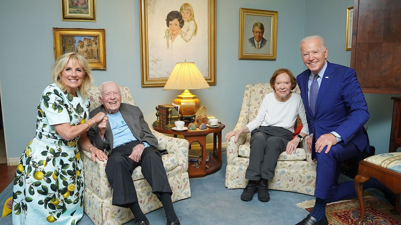 In this April 30, 2021, photo released by The White House, former President Jimmy Carter and former first lady Rosalynn Carter pose for a photo with President Joe Biden and first lady Jill Biden at the home of the Carter's in Plains Ga. (Adam Schultz, The White House via AP)