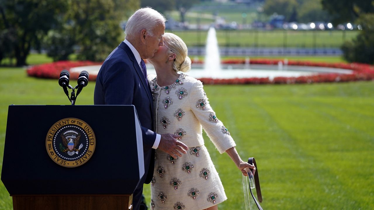 Actress Selma Blair kisses President Joe Biden on the cheek before taking her seat after she introduced Biden during an event to celebrate the Americans with Disabilities Act, on the South Lawn of the White House, Monday, Oct. 2, 2023, in Washington. (AP Photo/Evan Vucci)