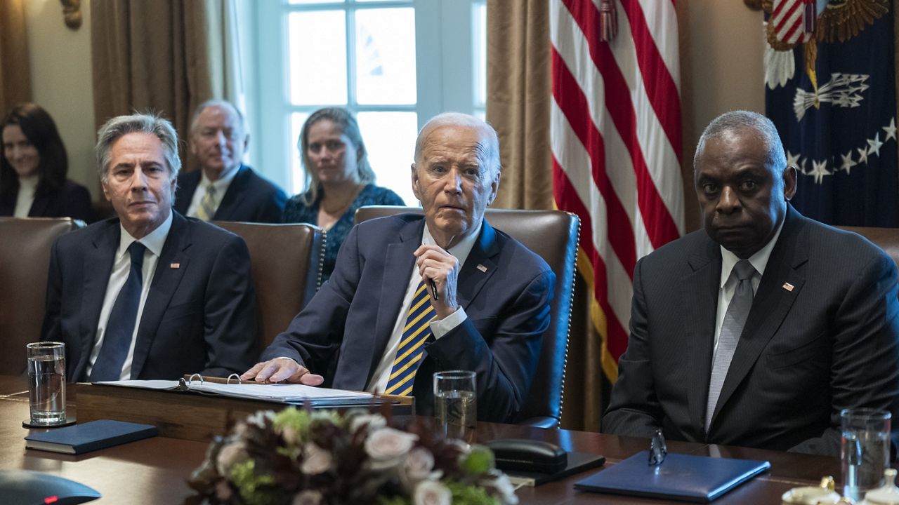 President Joe Biden flanked Secretary of State Antony Blinken, left, and Secretary of Defense Lloyd Austin, right, speaks during a meeting with the members of his cabinet and first lady Jill Biden, in the Cabinet Room of the White House, Friday, Sept. 20, 2024. (AP Photo/Manuel Balce Ceneta)