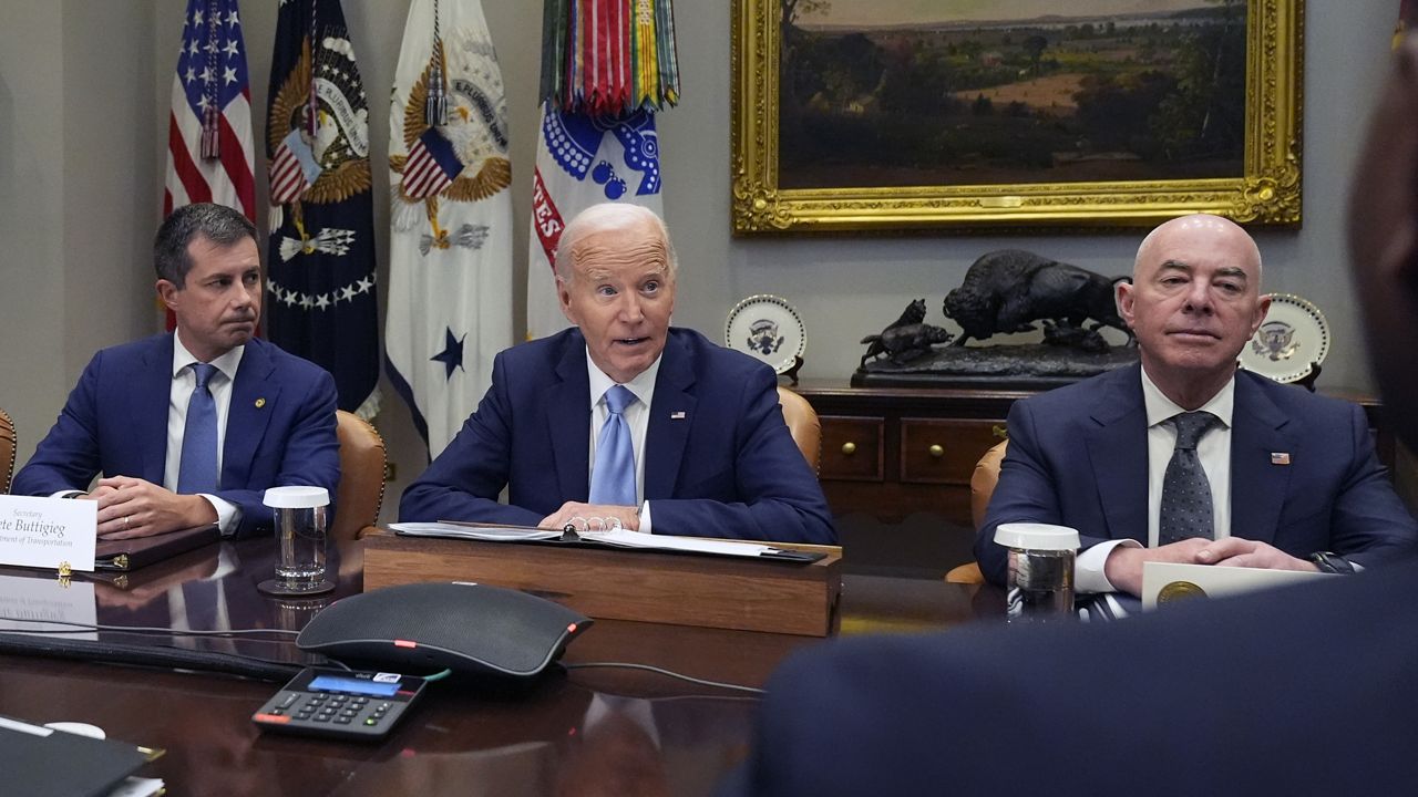 President Joe Biden speaks during a briefing on the government's response to Hurricane Helene in the Roosevelt Room of the White House in Washington, Tuesday, Oct. 1, 2024, as Secretary of Transportation Pete Buttigieg, left, and Secretary of Homeland Security Alejandro Mayorkas, right, look on. (AP Photo/Mark Schiefelbein)