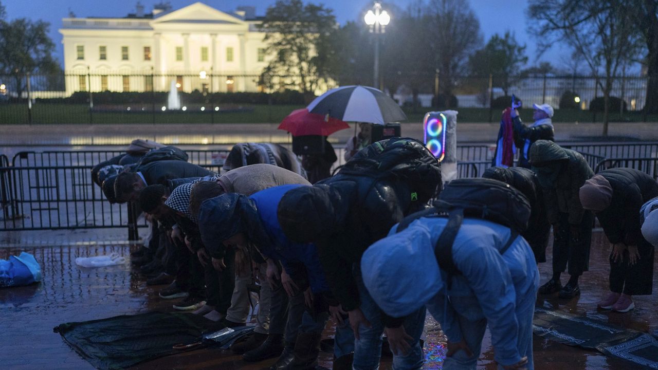 Protesters pray during a demonstration in support of Palestinians, Tuesday, April 2, 2024, at Lafayette Park across from the White House in Washington,. (AP Photo/Jose Luis Magana)