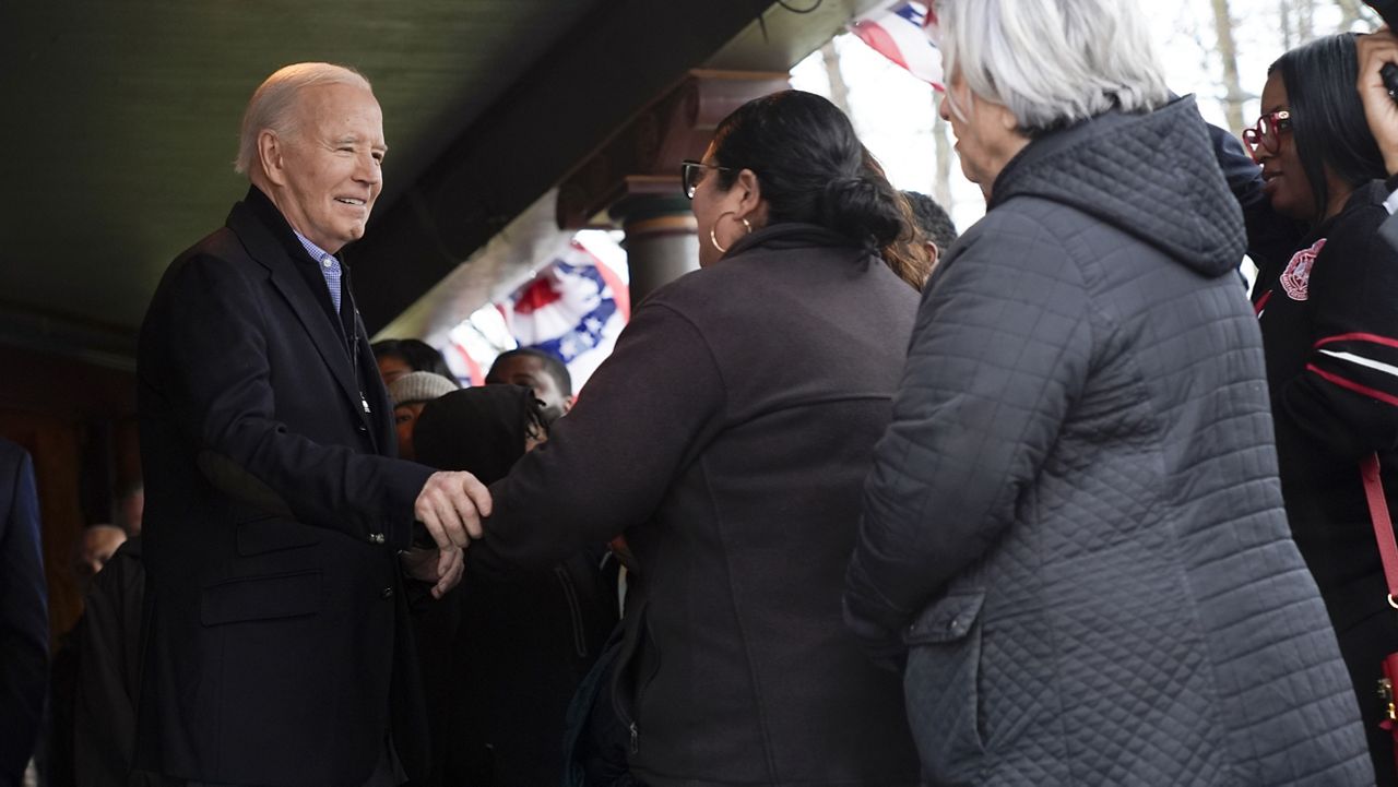 President Joe Biden, left, talks with supporters during a campaign event in Saginaw, Mich., Thursday, March 14, 2024. (AP Photo/Jacquelyn Martin)