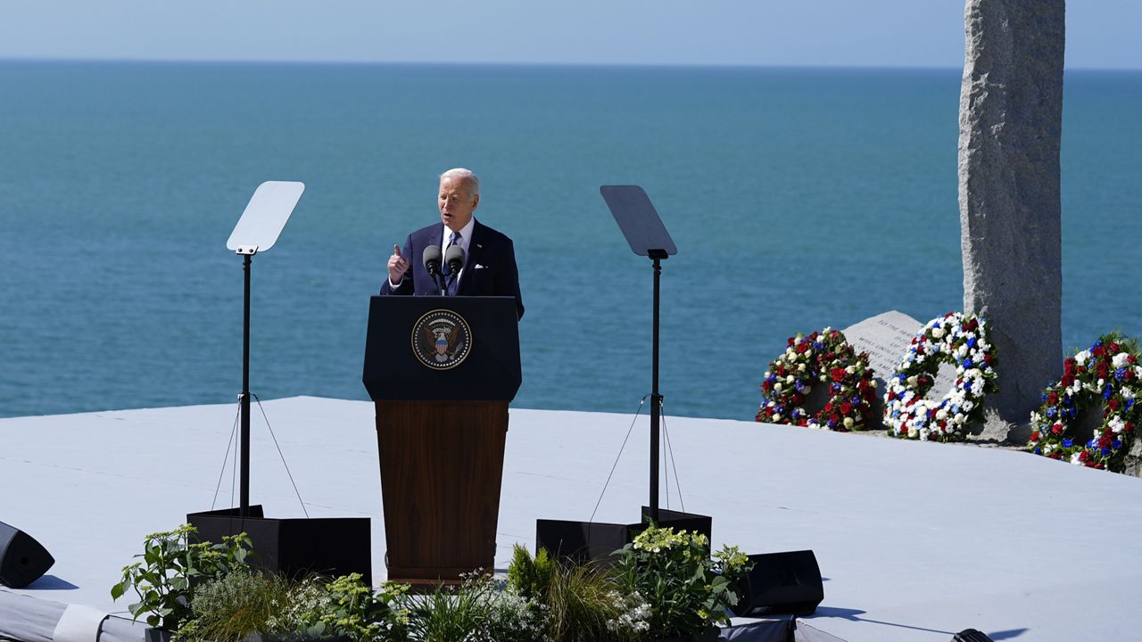 President Joe Biden delivers a speech on the legacy of Pointe du Hoc, and democracy around the world, Friday, June 7, 2024 as he stands next to the Pointe du Hoc monument in Normandy, France. (AP Photo/Evan Vucci)