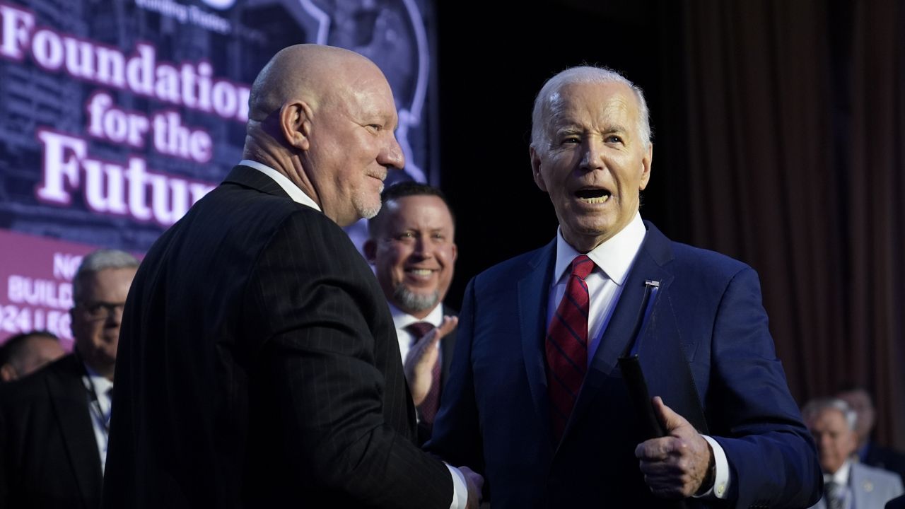 President Joe Biden talks with NABTU President Sean McGarvey after speaking to the North America's Building Trade Union National Legislative Conference, Wednesday, April 24, 2024, in Washington. (AP Photo/Evan Vucci)