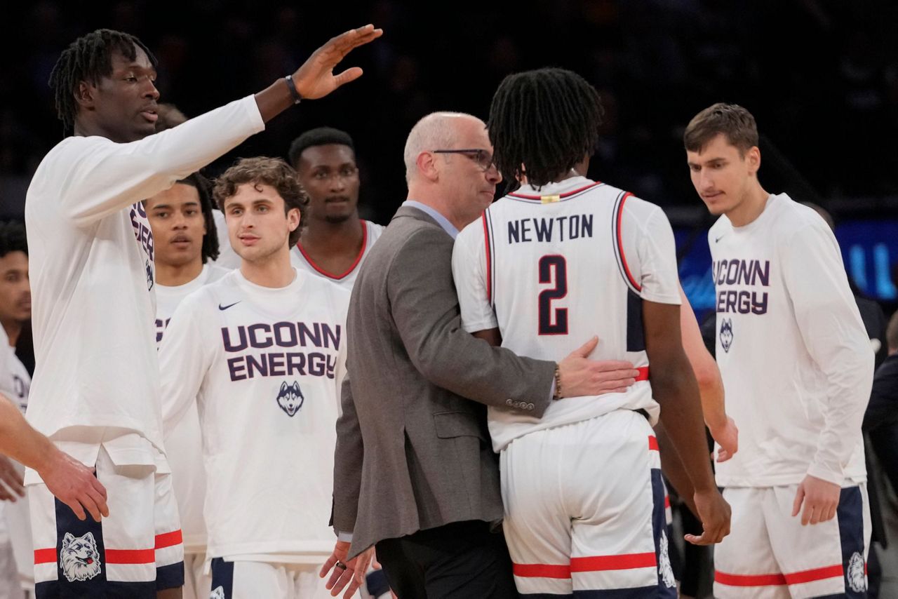 Florida center Micah Handlogten stretchered off court early at the SEC  final with broken left leg