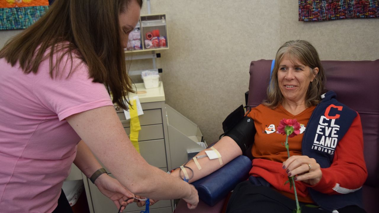 Waynesville donor Linda McBride donates blood at the Pink Out Blood Drive.