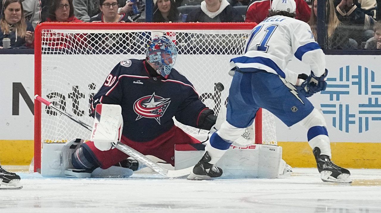 Tampa Bay Lightning center Anthony Cirelli (71) scores past Columbus Blue Jackets goaltender Elvis Merzlikins, left, in the second period of an NHL hockey game, Saturday, Feb. 10, 2024, in Columbus, Ohio. (AP Photo/Sue Ogrocki)