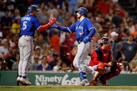 Toronto Blue Jays' Danny Jansen heads to the dugout after being