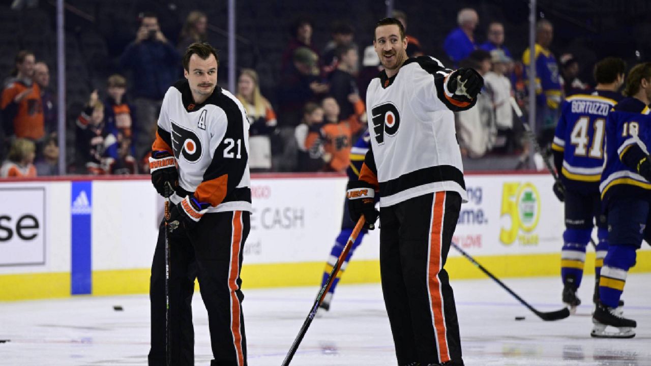 Philadelphia Flyers' Kevin Hayes, right, and Scott Laughton (21) skate during warm-ups before an NHL hockey game against the St. Louis Blues, Tuesday, Nov. 8, 2022, in Philadelphia. (AP Photo/Derik Hamilton)