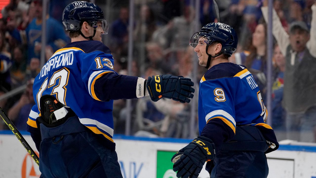 Jordan Kyrou and Robert Thomas of the St. Louis Blues head towards