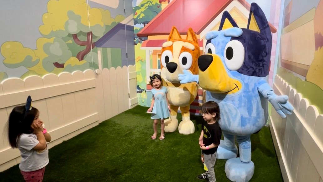 A group of children meet Bluey and Bingo at Camp's "Bluey" experience at Westfield Century City. (Spectrum News/Joseph Pimentel)