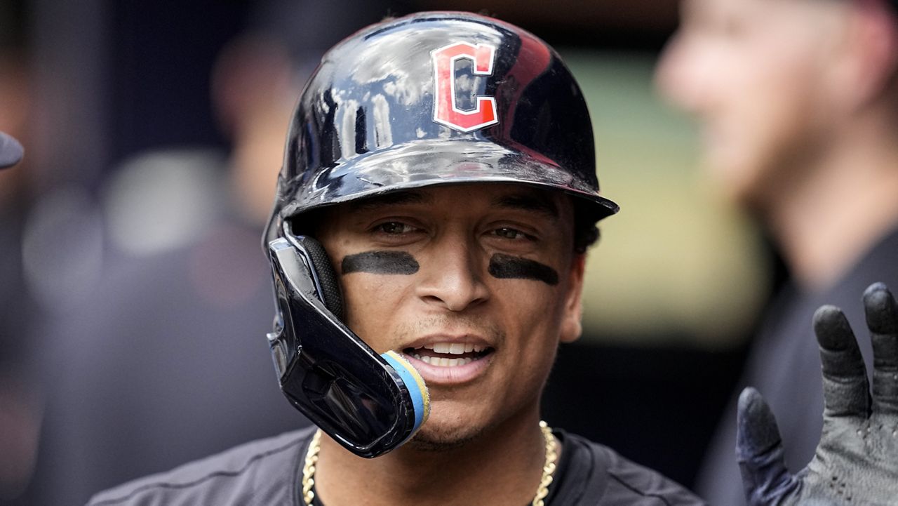 Cleveland Guardians' Bo Naylor (23) celebrates scoring against the Atlanta Braves on an RBI-single by Andrés Giménez (0) in the second inning of a baseball game, Sunday, April 28, 2024, in Atlanta. (AP Photo/Mike Stewart)