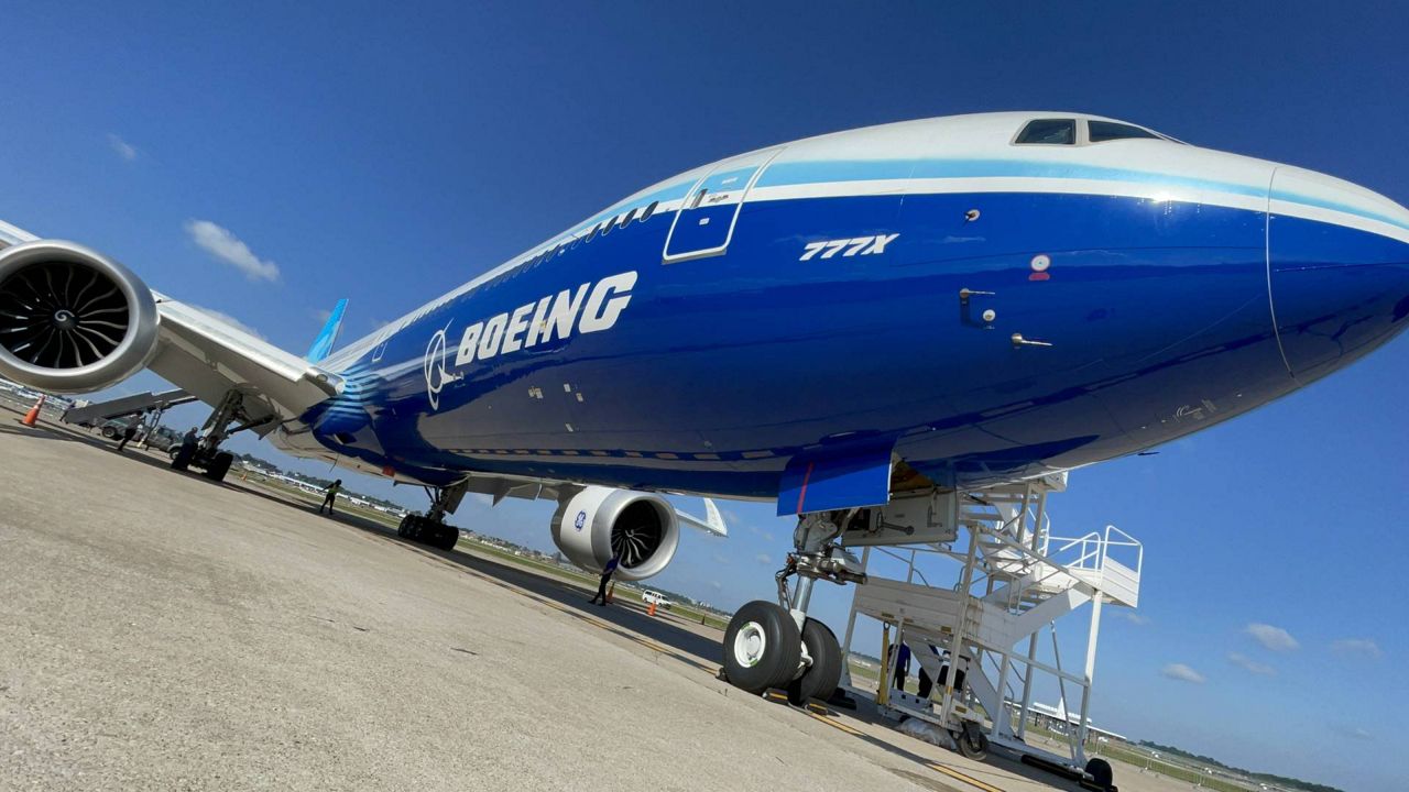 A Boeing 777-X test plane sits at St. Louis Lambert International Airport on June 26, 2023. St. Louis-based employees build more than 500 components of the next-generation commercial passenger plane which is due for delivery in 2025. (Spectrum News/Gregg Palermo)