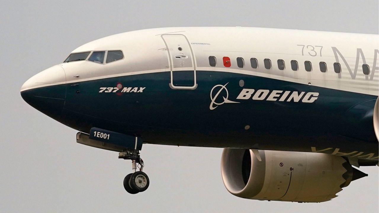 A Boeing 737 Max jet, piloted by Federal Aviation Administration (FAA) chief Steve Dickson, prepares to land at Boeing Field following a test flight on Sept. 30, 2020 in Seattle. (AP Photo/Elaine Thompson, File)