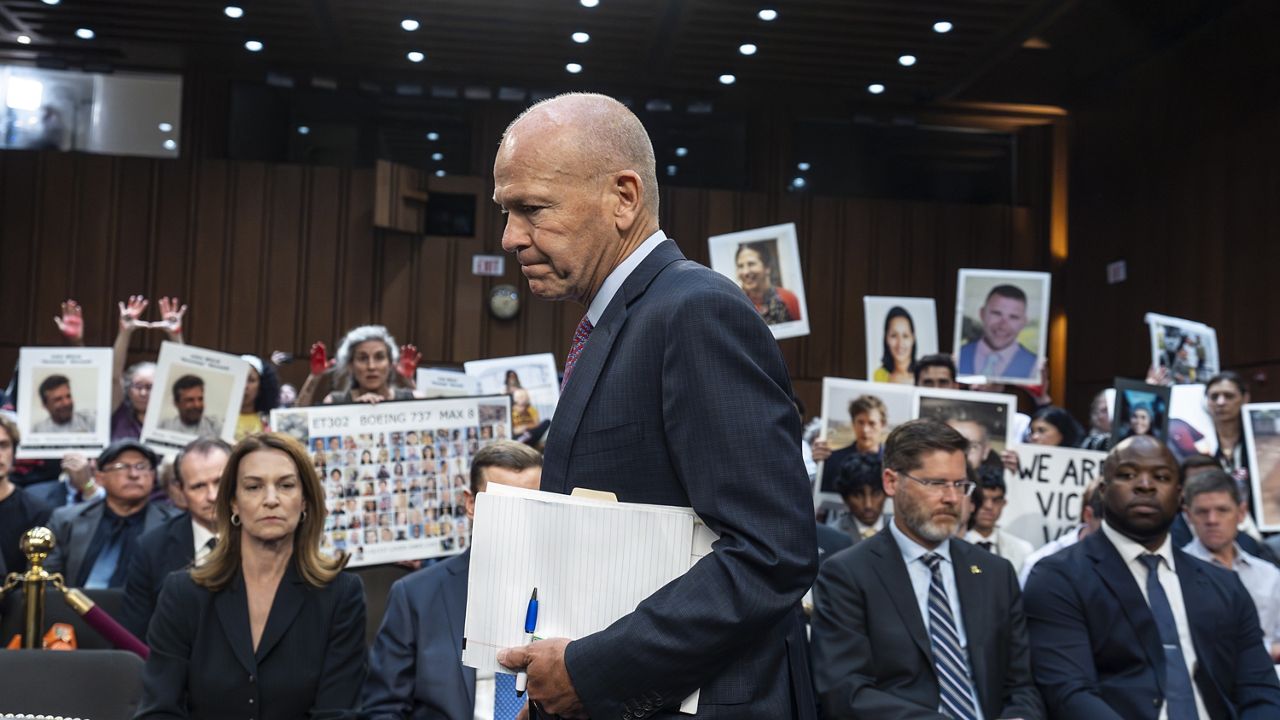 With protesters in the audience, Boeing CEO Dave Calhoun arrives at a Senate subcommittee hearing to answer to lawmakers about troubles at the aircraft manufacturer. (AP Photo/J. Scott Applewhite, File)