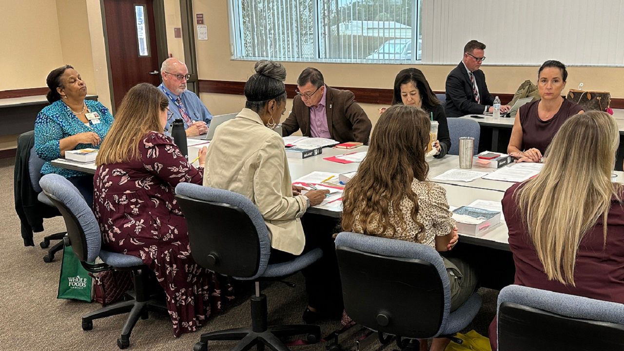 Committee members and Plant High School leaders discuss a proposed book ban at the school's library. The board voted to reject the ban. (Spectrum News/Roger Johnson)